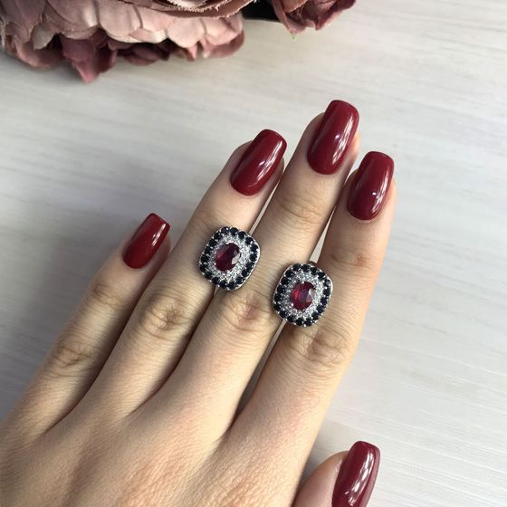 Silver earrings with a 4.575-carat ruby and a sapphire
