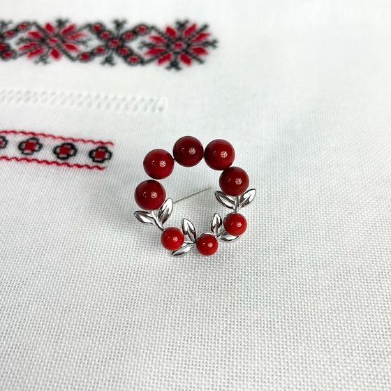 Silver brooch with coral