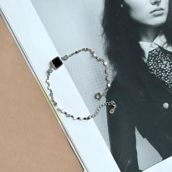 Silver bracelet with onyx, fianites