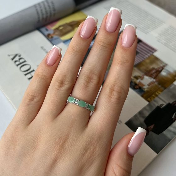 Silver ring with a 1.551-carat emerald and cubic zirconia