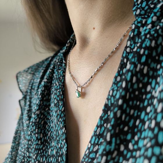 Silver pendant with emerald, fianites