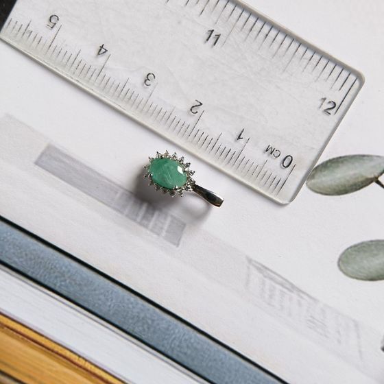 Silver pendant with an emerald and cubic zirconia